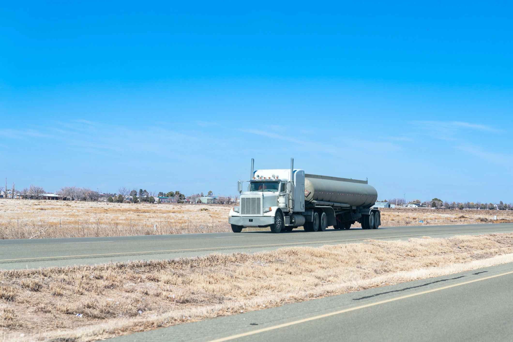 Tanker truck delivering potable water on a highway